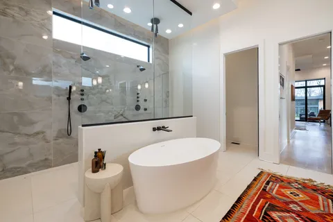 a bathroom with a sink a mirror and a bathtub