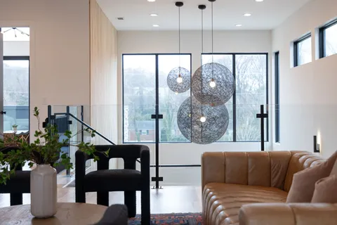 an aerial view of a house with a yard