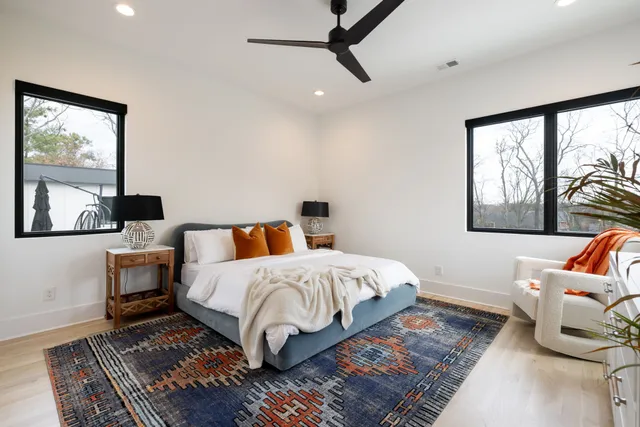 a view of an house with backyard and tree