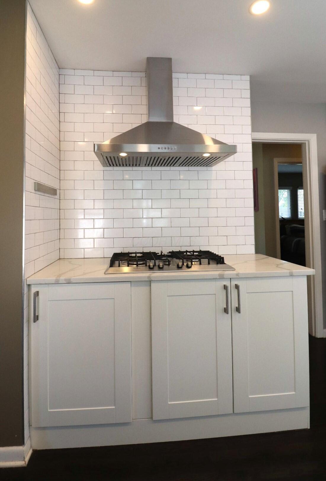 1950 Langham Road Columbus, OH 43221 - Photo 17 of 56 Stainless steel venthood and gas cooktop
