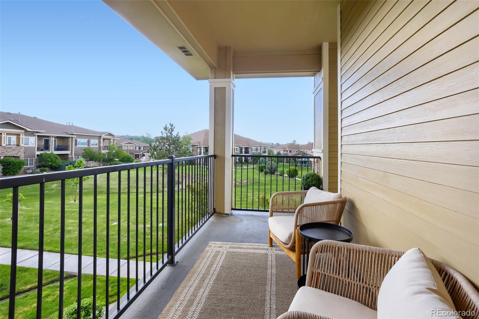 6232 Kilmer Loop, Unit 203 Golden, CO 80403 - Photo 17 of 33 a balcony with furniture