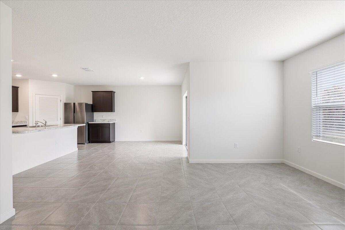 1072 Roseland Road Sebastian, FL 32958 - Photo 12 of 47 a view of a kitchen with a sink and a stove top oven