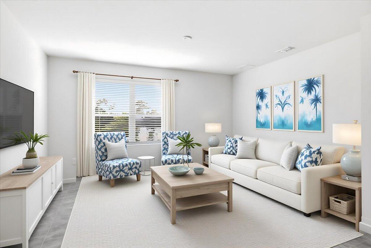 1072 Roseland Road Sebastian, FL 32958 - Photo 14 of 47 a living room with furniture and a flat screen tv