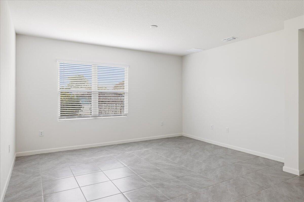 1072 Roseland Road Sebastian, FL 32958 - Photo 15 of 47 a view of an empty room with a window