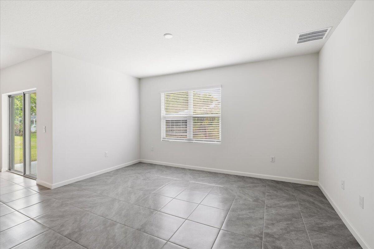 1072 Roseland Road Sebastian, FL 32958 - Photo 16 of 47 an empty room with windows