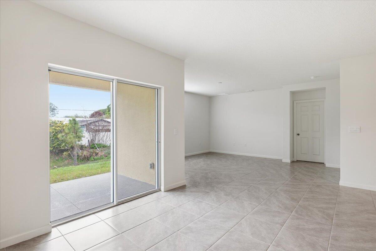 1072 Roseland Road Sebastian, FL 32958 - Photo 17 of 47 a view of an empty room with a window