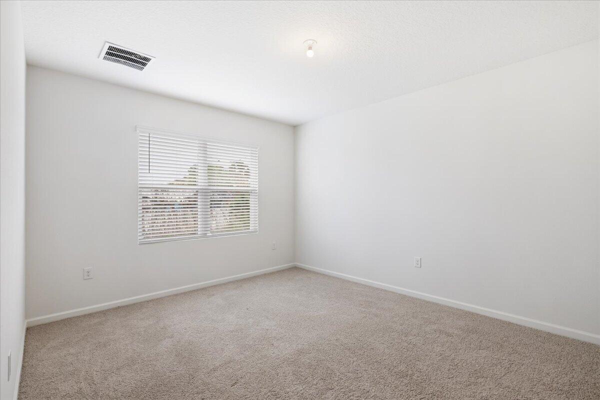 1072 Roseland Road Sebastian, FL 32958 - Photo 22 of 47 a view of an empty room with a window