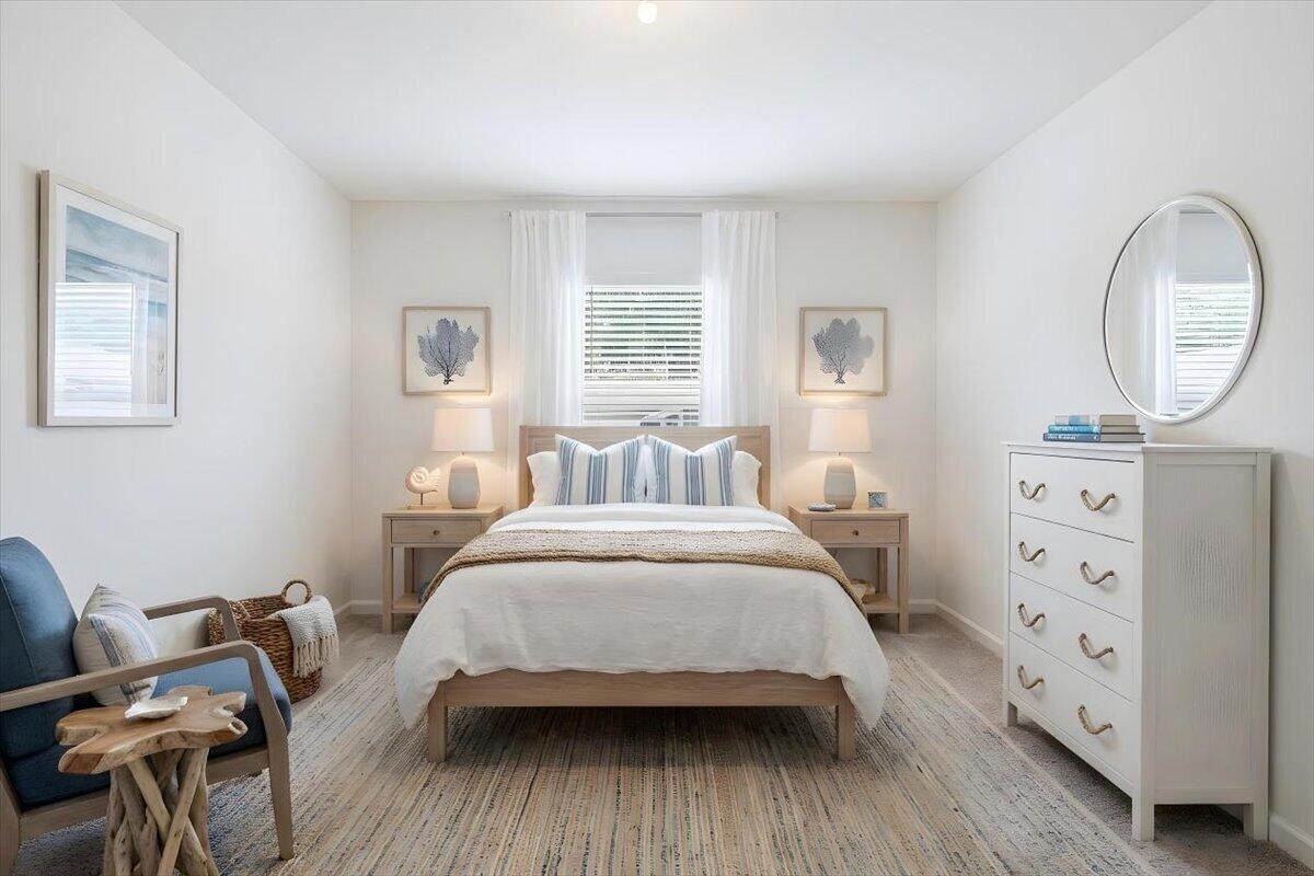 1072 Roseland Road Sebastian, FL 32958 - Photo 23 of 47 a bedroom with a bed a dresser and chair