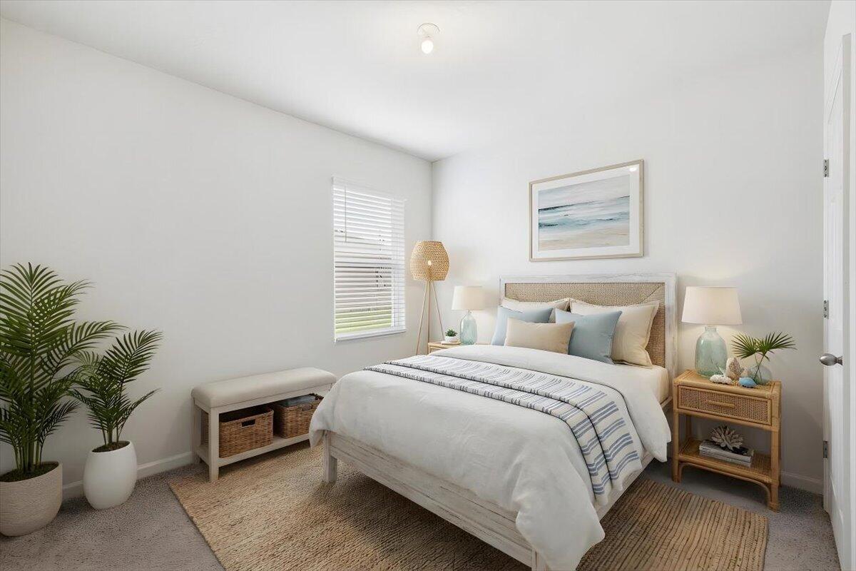 1072 Roseland Road Sebastian, FL 32958 - Photo 27 of 47 a bedroom with a bed and a potted plant