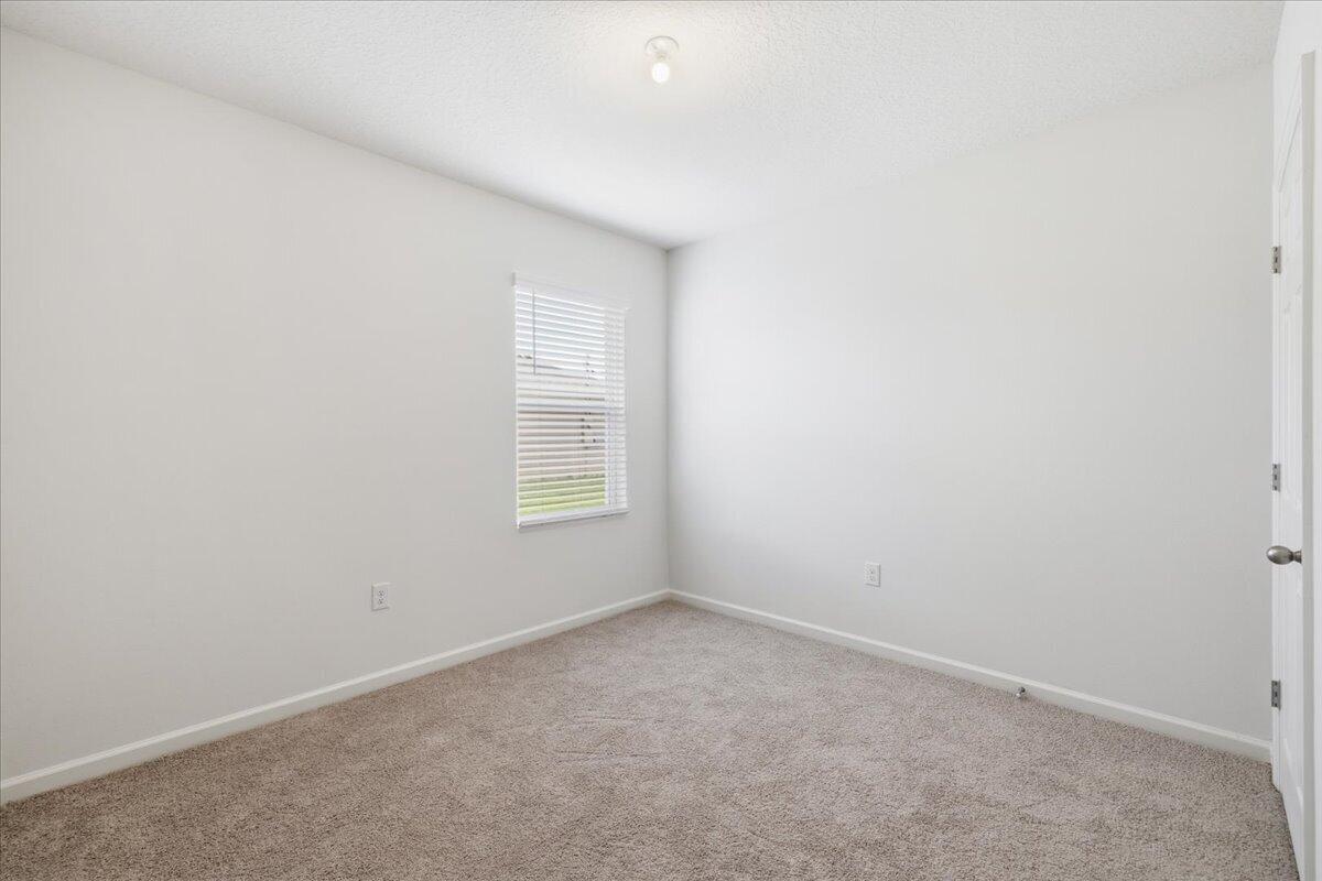 1072 Roseland Road Sebastian, FL 32958 - Photo 28 of 47 an empty room with a window