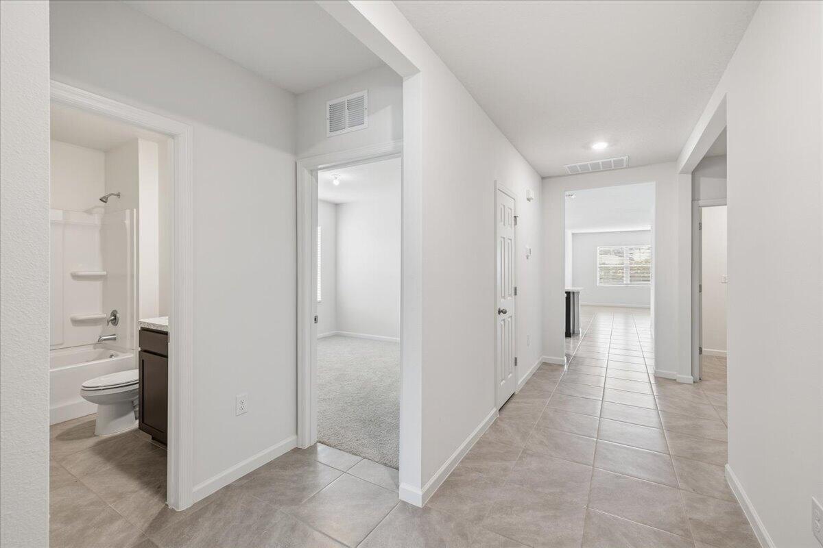 1072 Roseland Road Sebastian, FL 32958 - Photo 3 of 47 a view of a hallway with wooden shelves