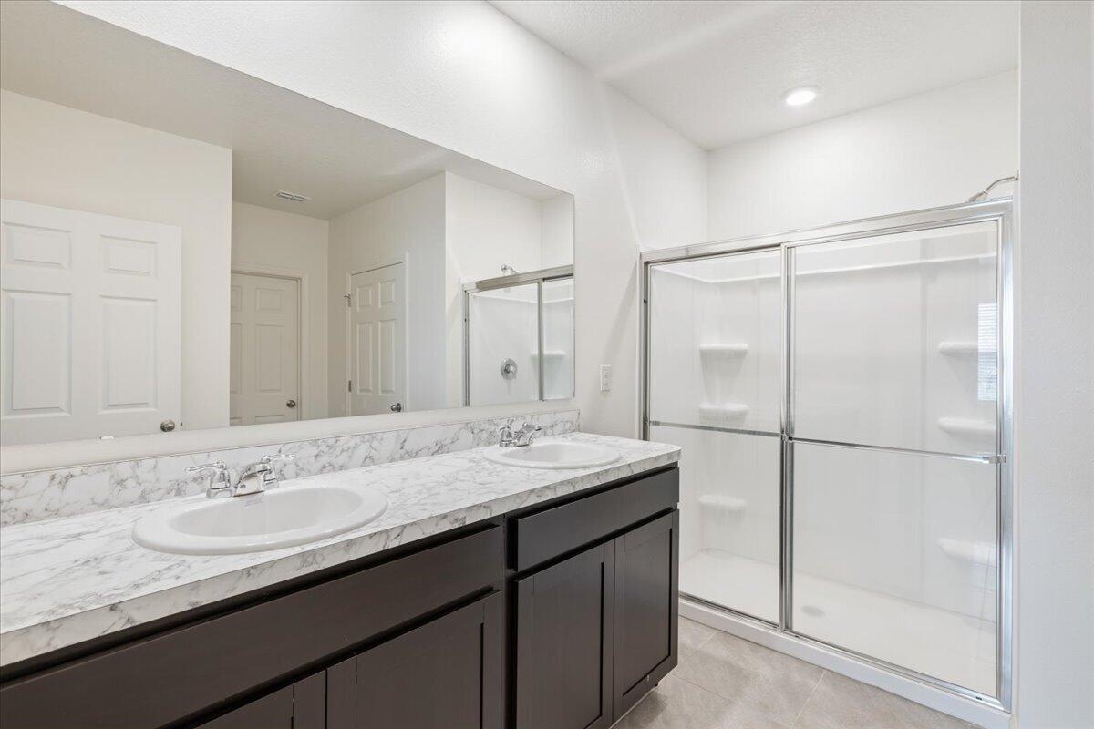 1072 Roseland Road Sebastian, FL 32958 - Photo 35 of 47 a bathroom with a granite countertop sink mirror and double