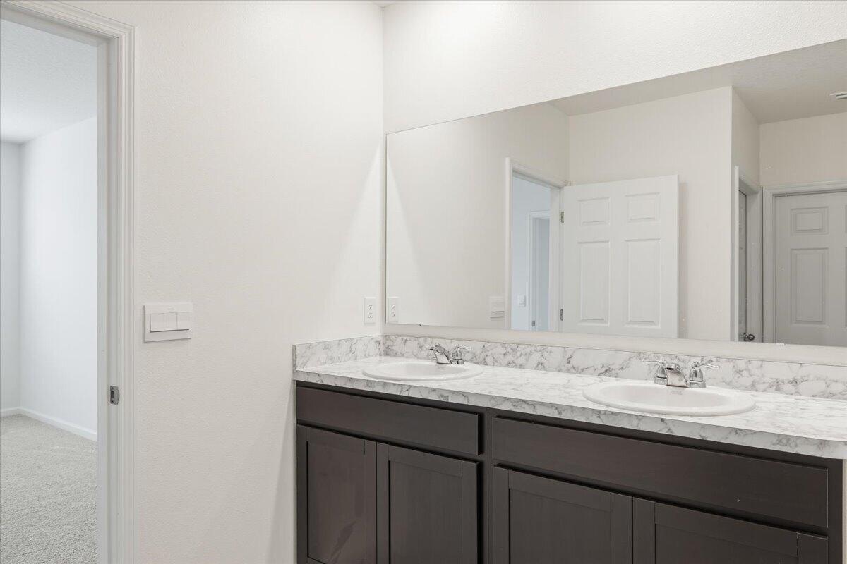 1072 Roseland Road Sebastian, FL 32958 - Photo 37 of 47 a bathroom with a sink and a mirror