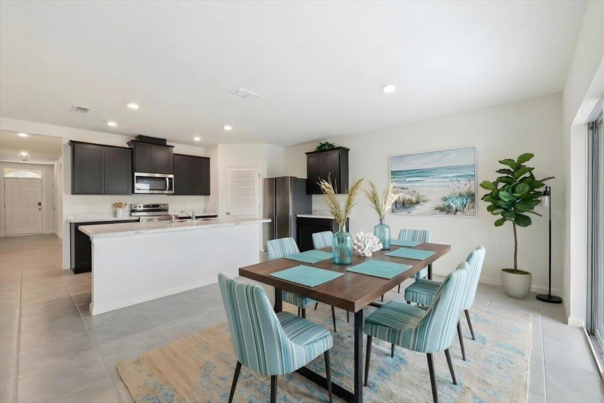 1072 Roseland Road Sebastian, FL 32958 - Photo 4 of 47 a view of a dining room with furniture and a kitchen
