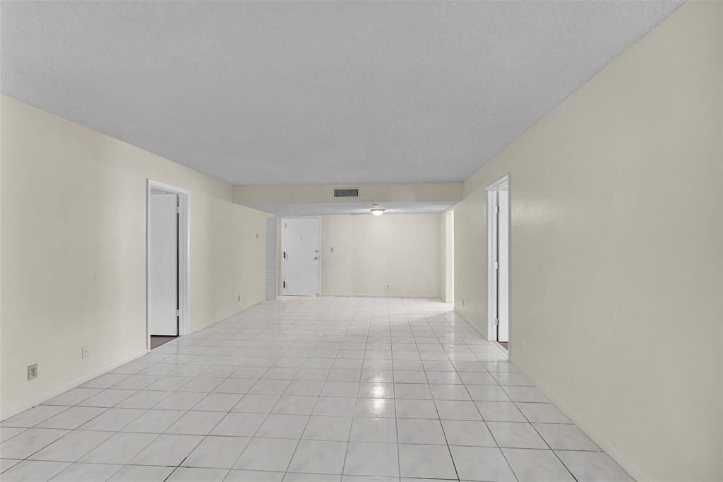 4218 Inverrary Boulevard, Unit 95B Lauderhill, FL 33319 - Photo 18 of 36 a view of an empty room and window