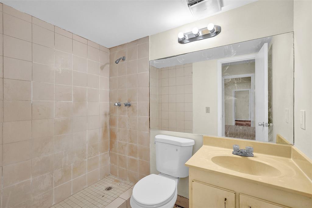 4218 Inverrary Boulevard, Unit 95B Lauderhill, FL 33319 - Photo 24 of 36 a bathroom with a sink toilet and shower