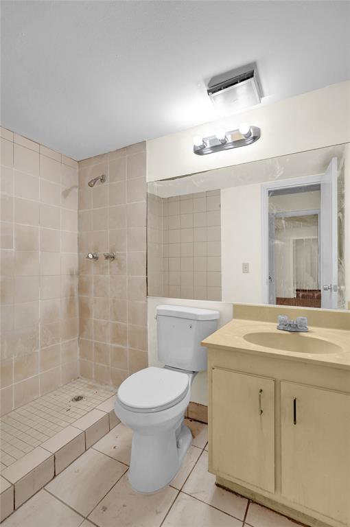 4218 Inverrary Boulevard, Unit 95B Lauderhill, FL 33319 - Photo 25 of 36 a bathroom with a sink a toilet and shower
