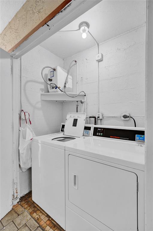 4218 Inverrary Boulevard, Unit 95B Lauderhill, FL 33319 - Photo 30 of 36 a utility room with dryer and washer