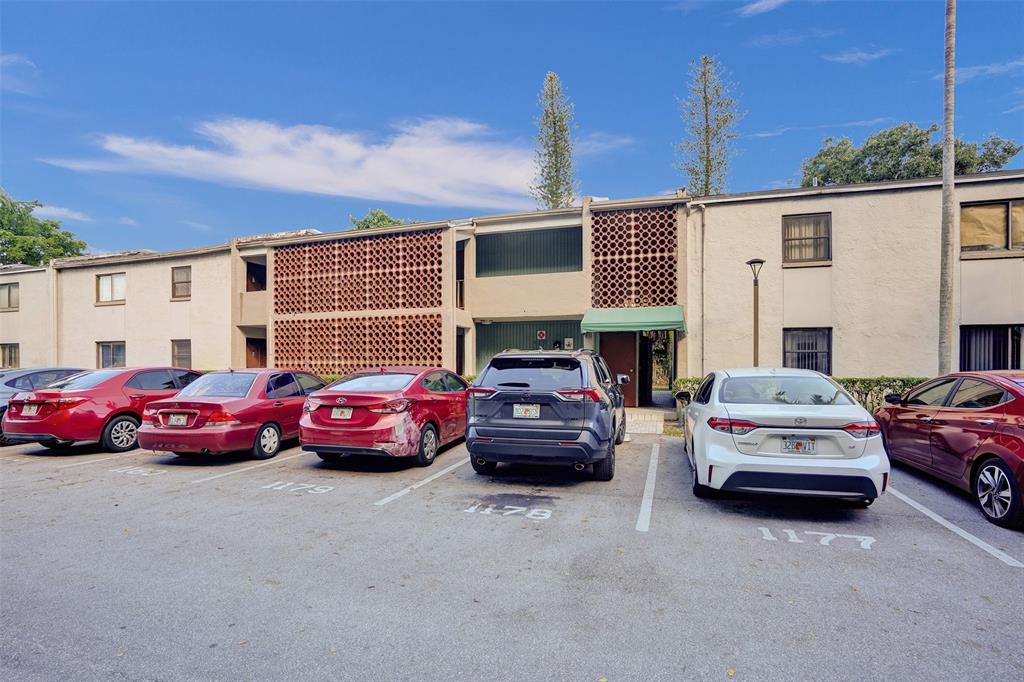 4218 Inverrary Boulevard, Unit 95B Lauderhill, FL 33319 - Photo 32 of 36 a car parked in front of a house