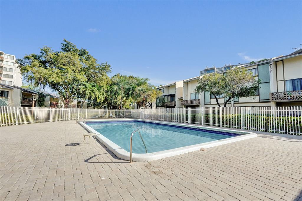 4218 Inverrary Boulevard, Unit 95B Lauderhill, FL 33319 - Photo 35 of 36 a view of a house with swimming pool