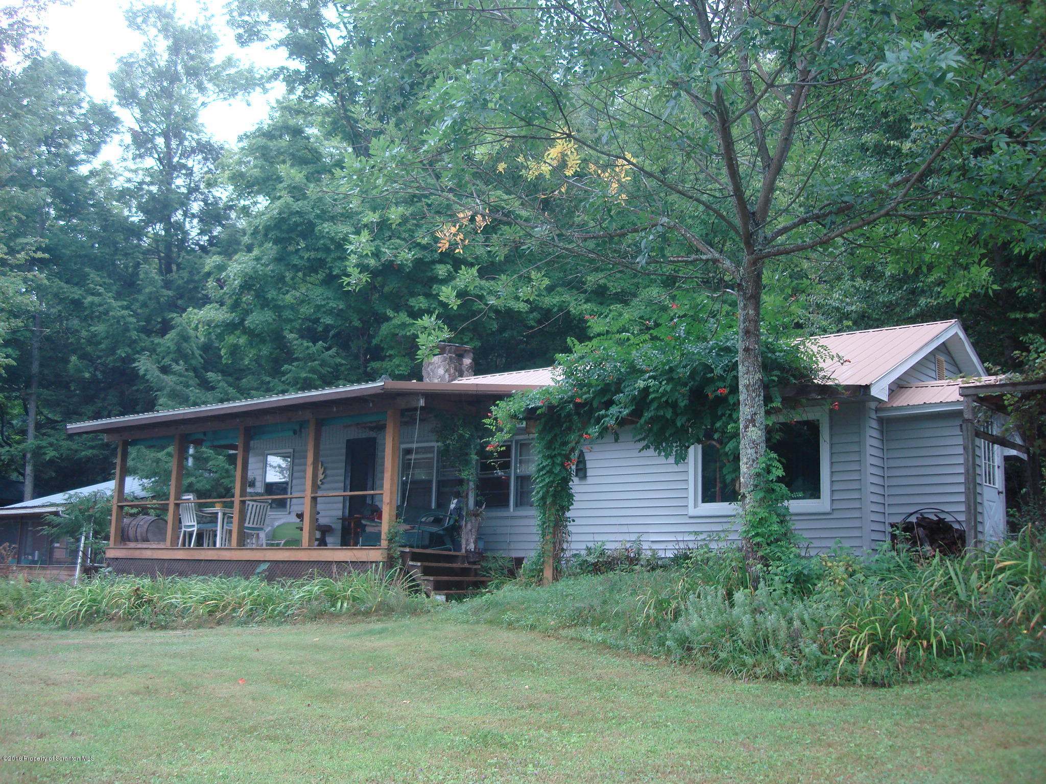 367 Crescent Lake Road Meshoppen, PA 18630 - Photo 1 of 23 a view of a house with backyard