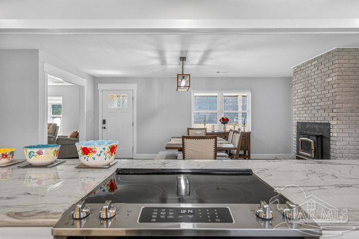 8940 Indian Ford Road Milton, FL 32570 - Photo 30 of 54 a living room with furniture and a fireplace