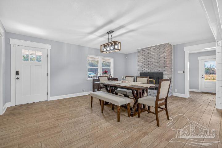 8940 Indian Ford Road Milton, FL 32570 - Photo 31 of 54 a dining room with furniture and window