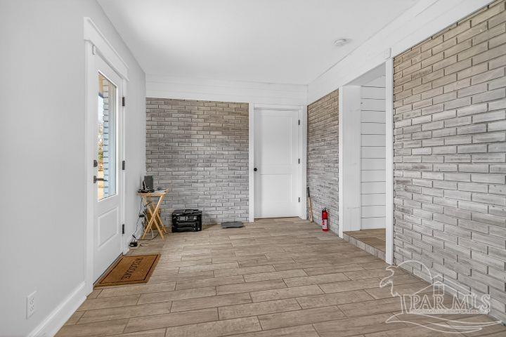8940 Indian Ford Road Milton, FL 32570 - Photo 34 of 54 a view of a livingroom with wooden floor and furniture