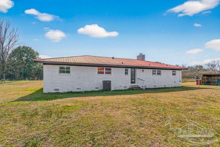 8940 Indian Ford Road Milton, FL 32570 - Photo 4 of 54 a view of a house with a backyard