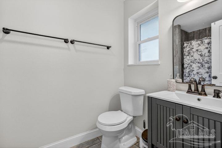 8940 Indian Ford Road Milton, FL 32570 - Photo 41 of 54 a bathroom with a sink toilet and shower