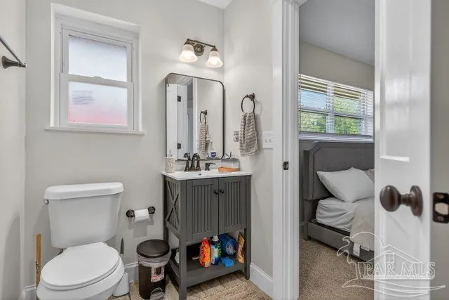 a bedroom with bed and window