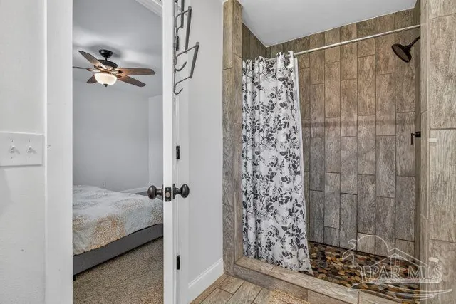 a bedroom with a bed and a dresser