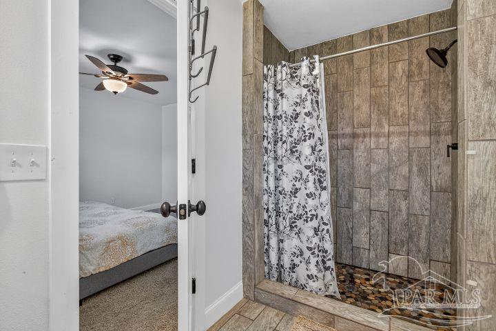 8940 Indian Ford Road Milton, FL 32570 - Photo 43 of 54 a bathroom with a shower