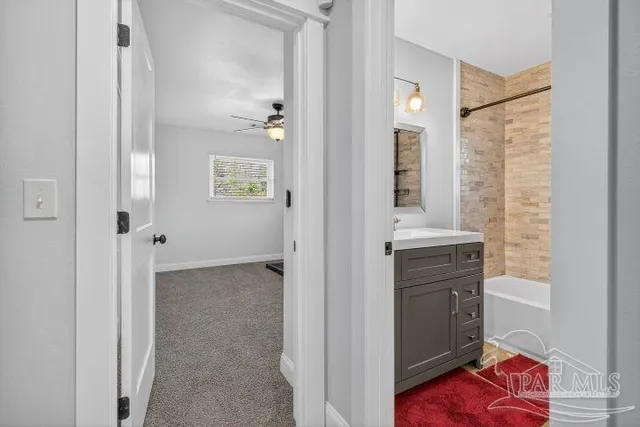 a bathroom with a sink and a bathtub