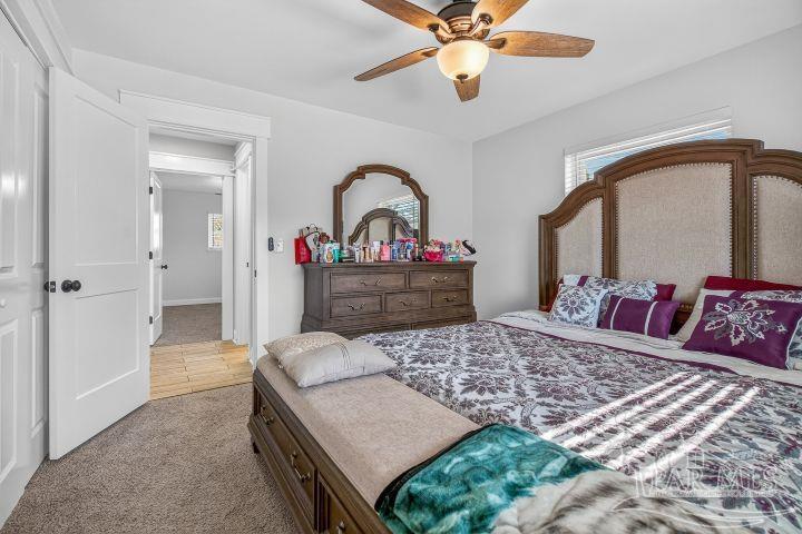 8940 Indian Ford Road Milton, FL 32570 - Photo 47 of 54 a bedroom with a bed and a dresser