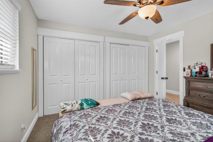 8940 Indian Ford Road Milton, FL 32570 - Photo 48 of 54 a bedroom with a bed and a cabinets