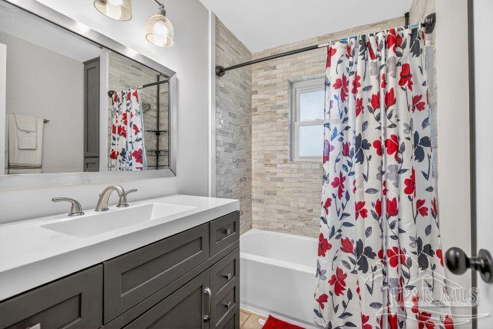 8940 Indian Ford Road Milton, FL 32570 - Photo 49 of 54 a bathroom with a sink and a bathtub