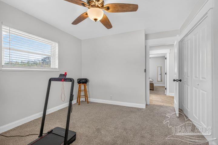 8940 Indian Ford Road Milton, FL 32570 - Photo 52 of 54 a view of a workspace with furniture and a window