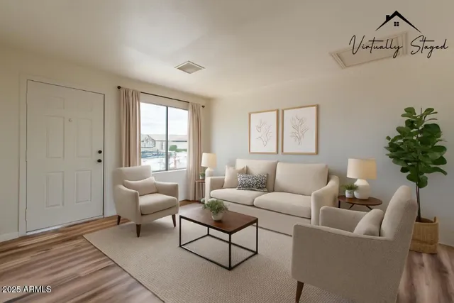 a living room with furniture and a large window