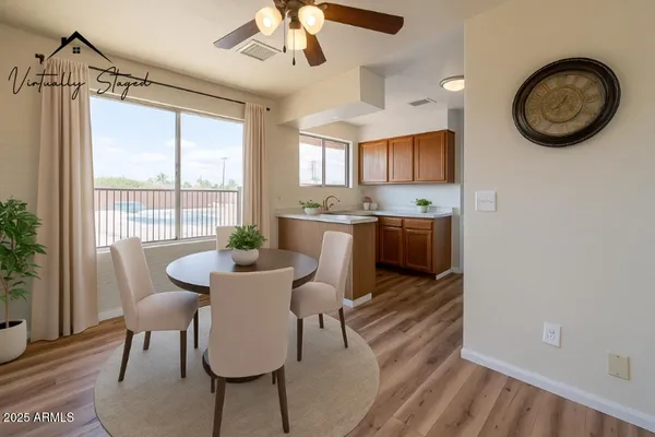 a view of a dining room with furniture window and wooden floor