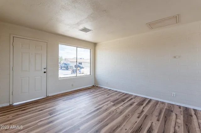 a view of a storage & utility room with wooden floor