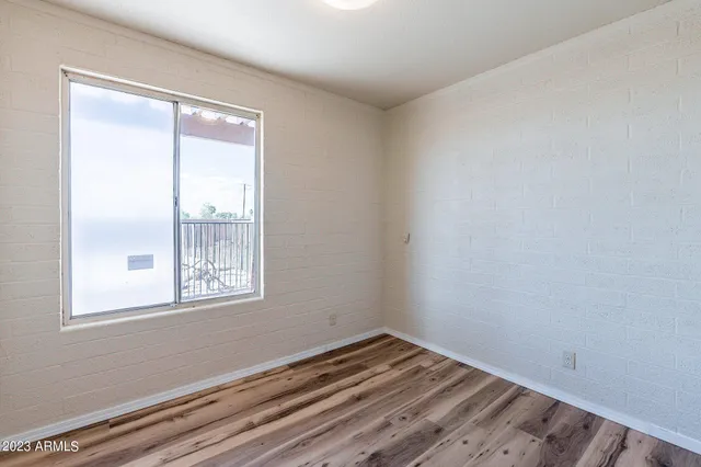 a bedroom with a bed and a chair