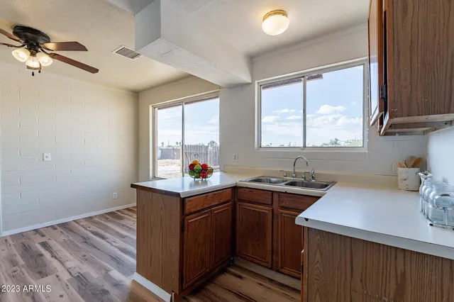 a kitchen with a sink stove and window