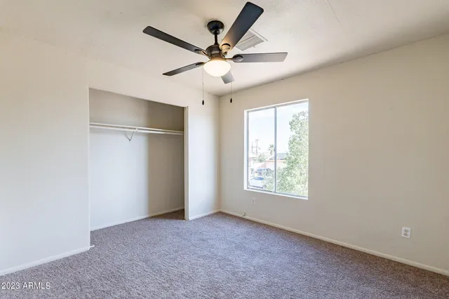 a view of an empty room with a window