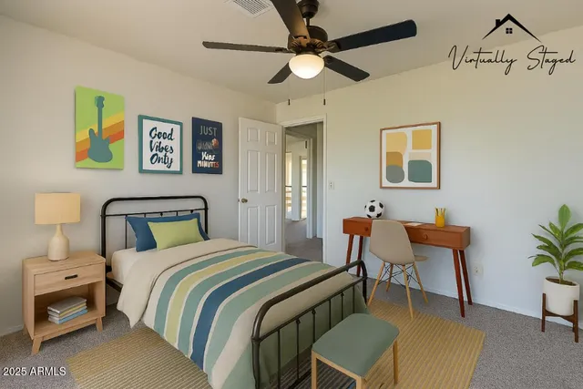 an empty room with a chandelier fan and closet