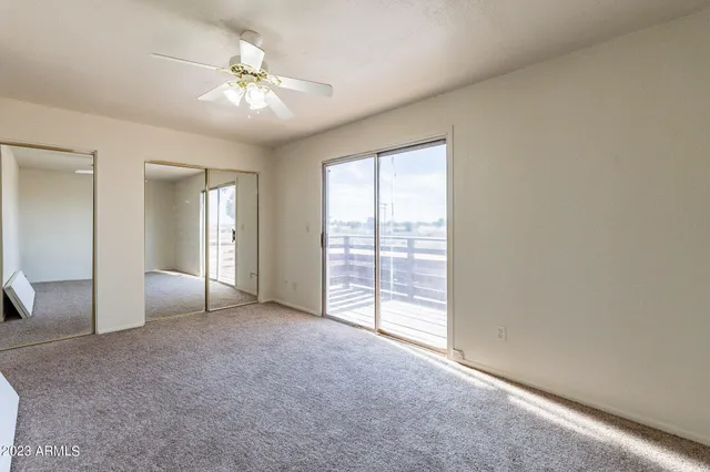 a view of a house with wooden floor and a yard