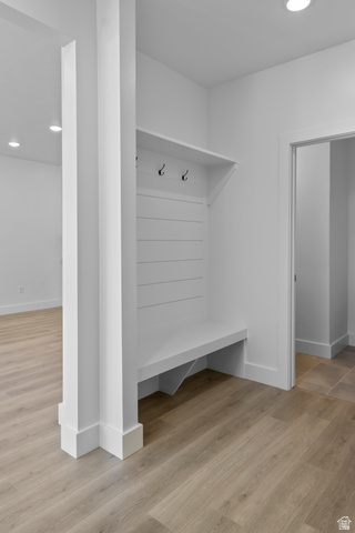 248 West 2920th Street South Logan, UT 84321 - Photo 22 of 47 Built-in bench with coat hooks, wood-finish flooring, recessed lighting, and white trim