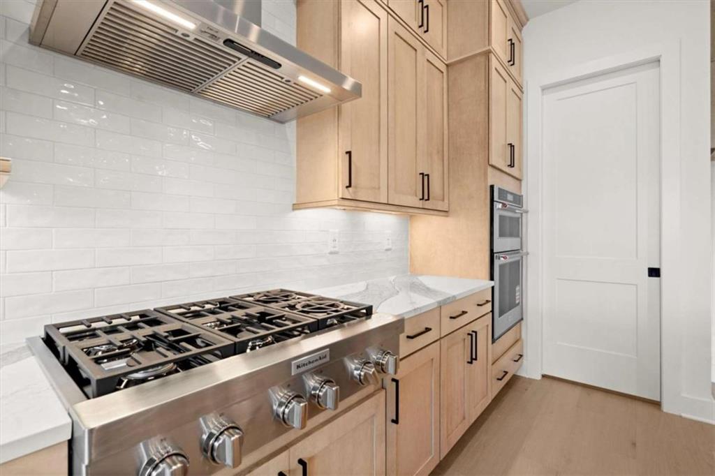 326 Treble Way Alpharetta, GA 30009 - Photo 11 of 47 a kitchen with granite countertop a stove and a refrigerator