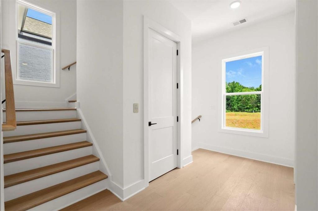 326 Treble Way Alpharetta, GA 30009 - Photo 18 of 47 a view of an entryway with staircase