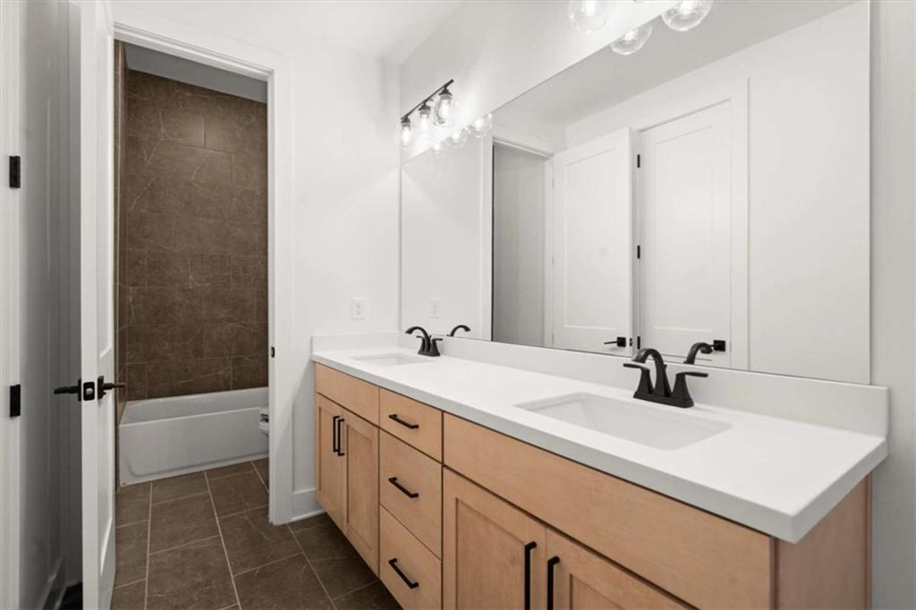 326 Treble Way Alpharetta, GA 30009 - Photo 25 of 47 a bathroom with a double vanity sink a and mirror
